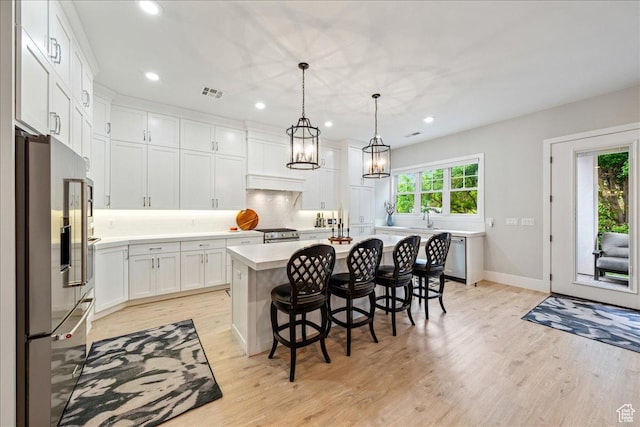 684 S 990 W, Hurricane, UT 84737 - kitchen with appliances with stainless steel finishes, light countertops, recessed lighting, light wood-style flooring, and backsplash