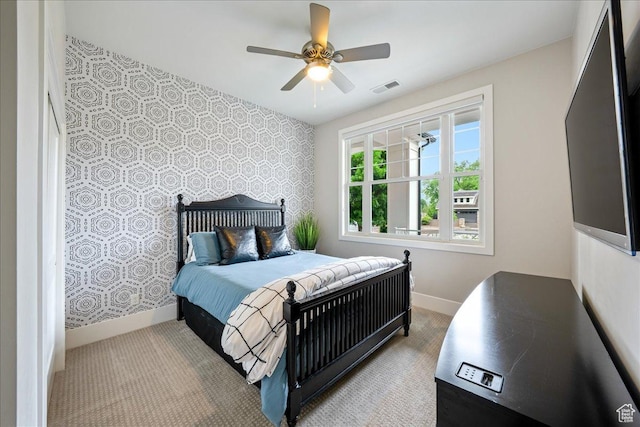 684 S 990 W, Hurricane, UT 84737 - carpeted bedroom with wallpapered walls, baseboards, an accent wall, and a ceiling fan