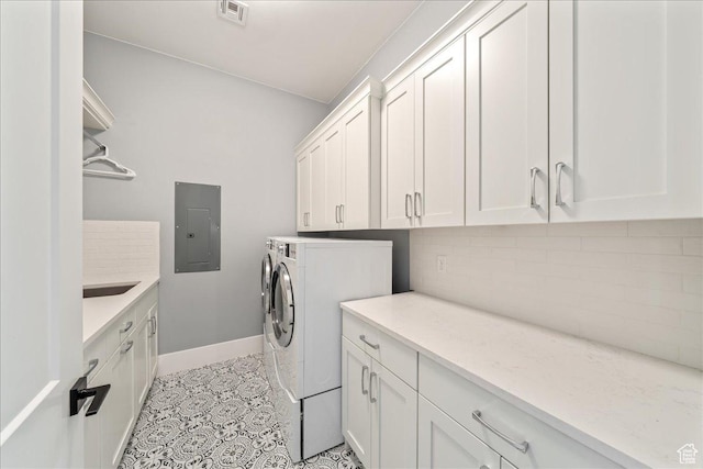 684 S 990 W, Hurricane, UT 84737 - laundry area with electric panel, cabinet space, baseboards, independent washer and dryer, and light tile patterned floors