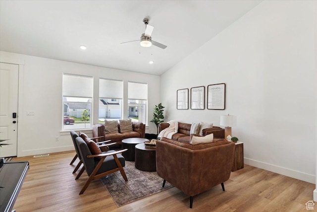 living room with ceiling fan, light wood-style floors, baseboards, lofted ceiling, and recessed lighting