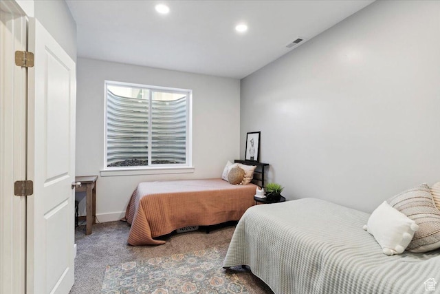 carpeted bedroom with recessed lighting