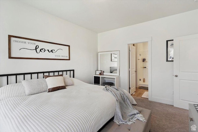 carpeted bedroom with ensuite bathroom