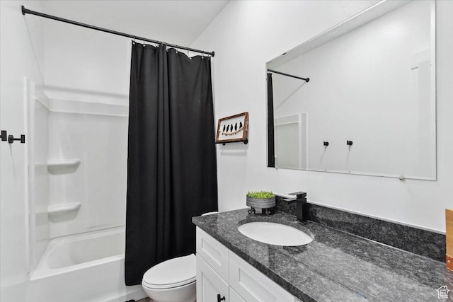 full bath featuring toilet, vanity, and shower / bath combo with shower curtain