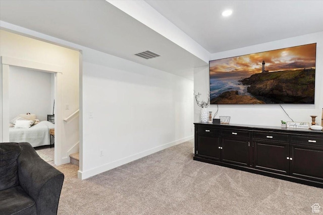 living room with light colored carpet, baseboards, and recessed lighting
