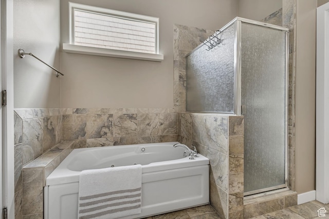 full bathroom with a stall shower and a whirlpool tub