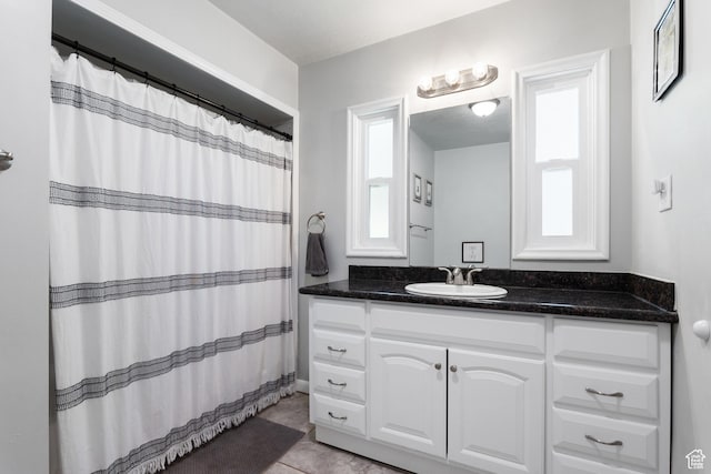 bathroom with vanity, tile patterned flooring, and a shower with curtain