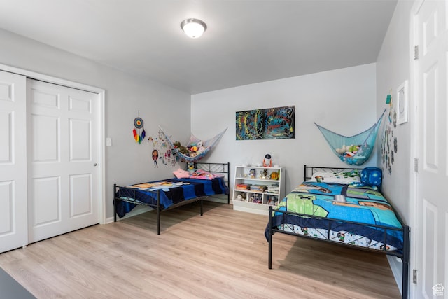 bedroom with wood finished floors and baseboards