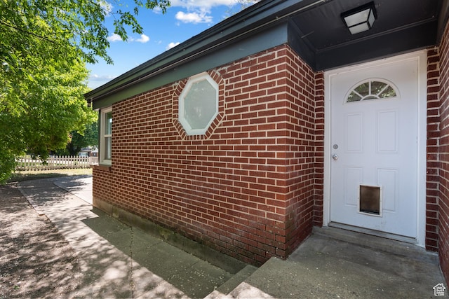 view of side of home featuring brick siding
