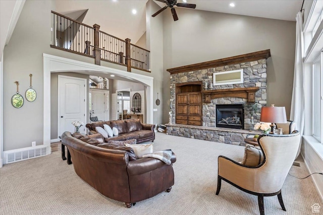 916 Country Ln, Farmington, UT 84025 - living room featuring ceiling fan, carpet flooring, high vaulted ceiling, a stone fireplace, and baseboards