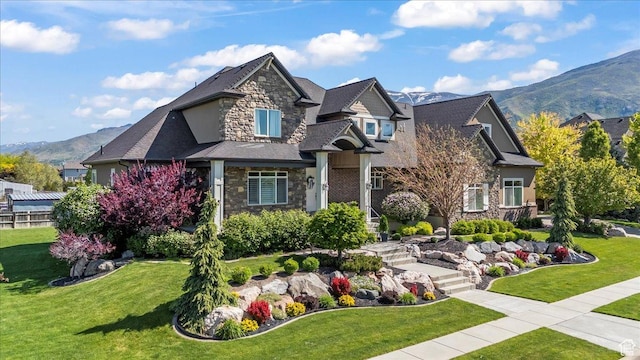 916 Country Ln, Farmington, UT 84025 - craftsman-style home with stone siding, a mountain view, and a front yard