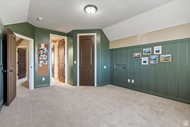 916 Country Ln, Farmington, UT 84025 - additional living space with vaulted ceiling and carpet