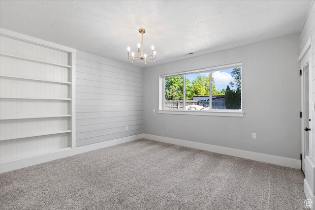 916 Country Ln, Farmington, UT 84025 - empty room with a chandelier, carpet flooring, baseboards, and a textured ceiling