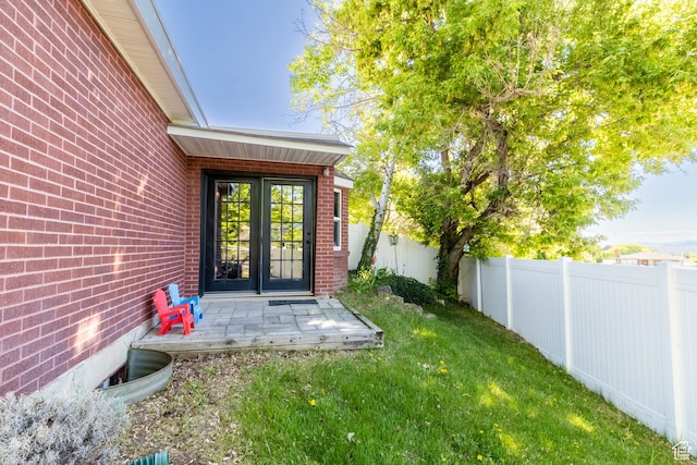 view of exterior entry featuring brick siding