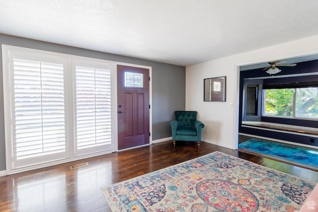 entrance foyer with wood finished floors and baseboards