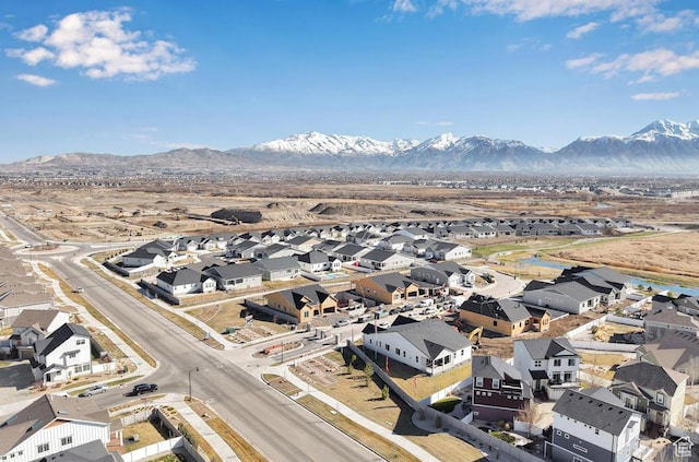 aerial perspective of suburban area featuring a mountain backdrop