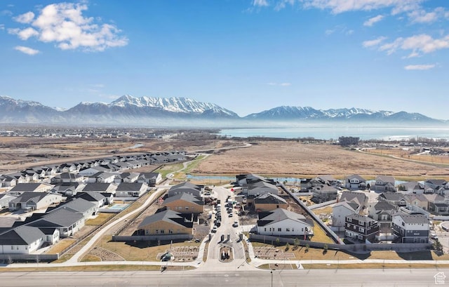 aerial perspective of suburban area with a water and mountain view