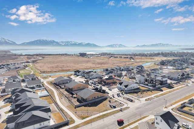 aerial view of residential area with a water and mountain view