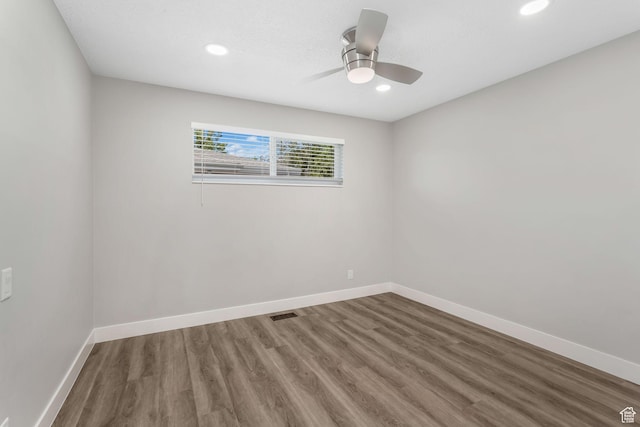 unfurnished room with wood finished floors, baseboards, recessed lighting, and ceiling fan