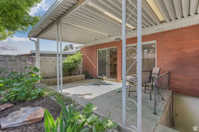 view of patio featuring fence