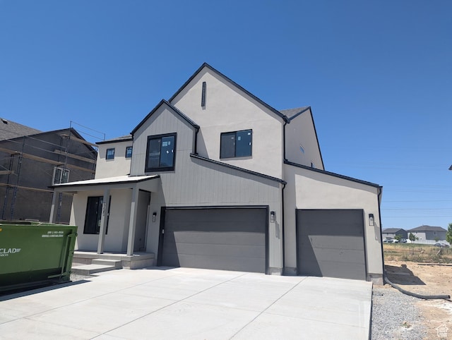 723 N Plainsman Dr Unit 109, Spanish Fork, UT 84660 - view of front of home featuring concrete driveway, an attached garage, and stucco siding