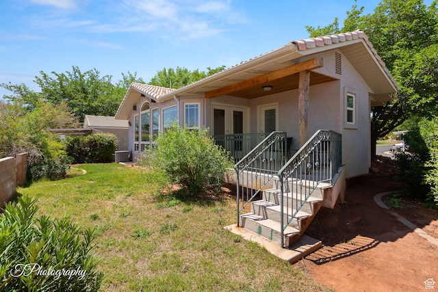 180 N 1100 E Unit 116, Washington, UT 84780 - back of house with stucco siding, a yard, and a tiled roof