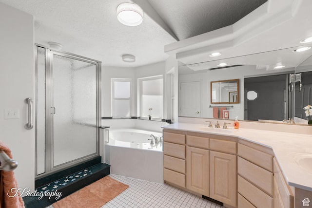 180 N 1100 E Unit 116, Washington, UT 84780 - full bathroom featuring a stall shower, a garden tub, double vanity, tile patterned floors, and a textured ceiling