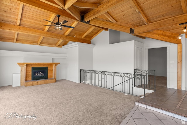 180 N 1100 E Unit 116, Washington, UT 84780 - unfurnished living room with wooden ceiling, a ceiling fan, beam ceiling, tile patterned flooring, and a tiled fireplace