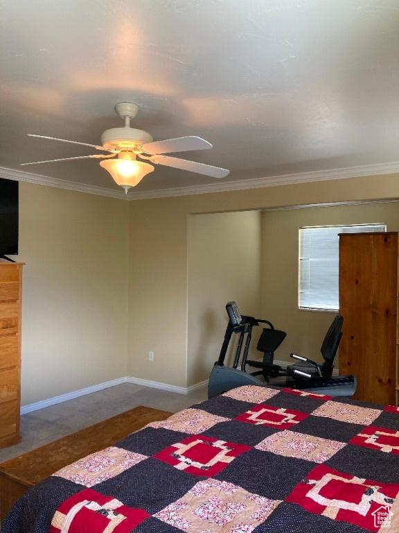 bedroom featuring crown molding and a ceiling fan
