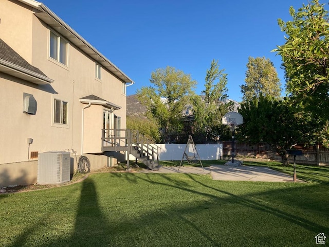 view of yard with central AC