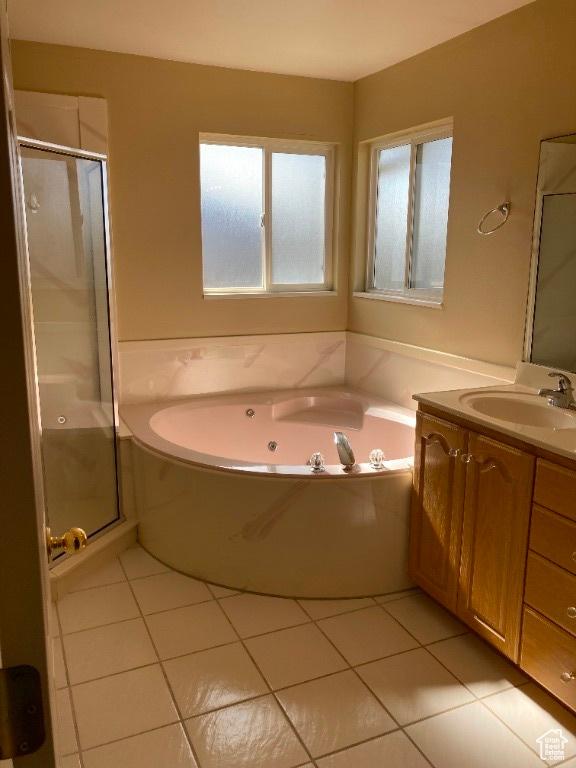full bath with tile patterned flooring, a shower stall, vanity, and a whirlpool tub
