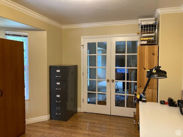 doorway featuring french doors, wood finished floors, and ornamental molding