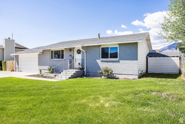 ranch-style house featuring a garage, brick siding, driveway, and a front lawn