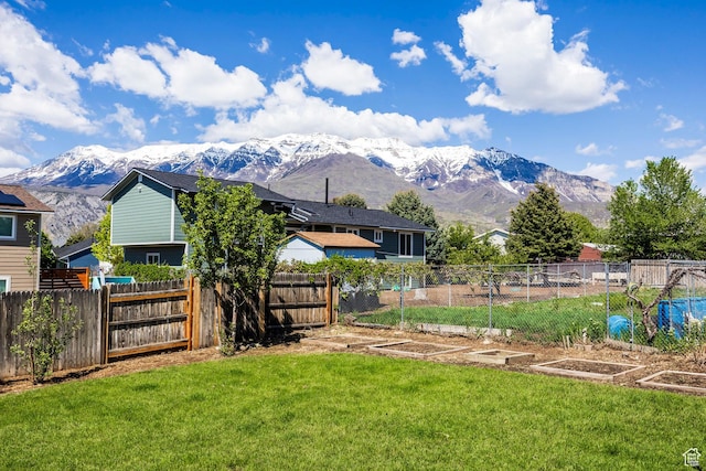 view of yard featuring a mountain view and a garden