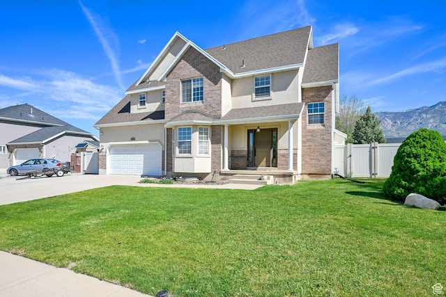 traditional home featuring stucco siding, a gate, concrete driveway, a garage, and a shingled roof
