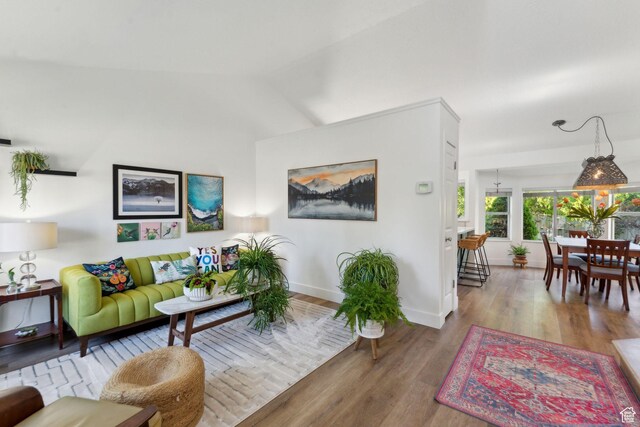 1298 E 5875 S, Ogden, UT 84405 - living room featuring wood finished floors, baseboards, and vaulted ceiling
