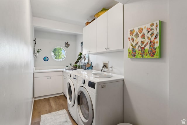 1298 E 5875 S, Ogden, UT 84405 - washroom with separate washer and dryer, light wood finished floors, and cabinet space