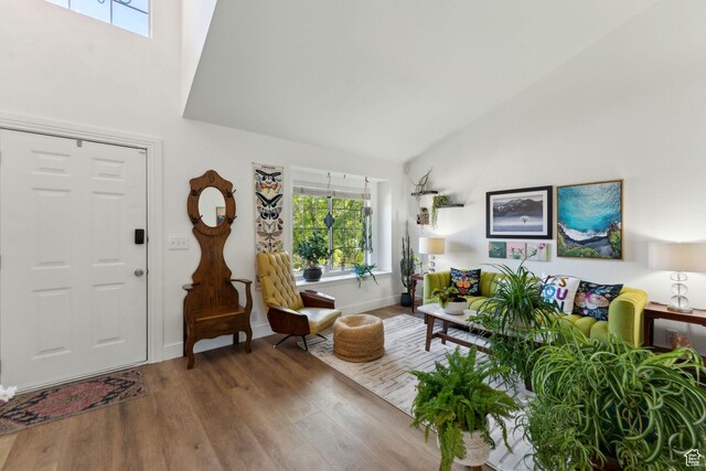 1298 E 5875 S, Ogden, UT 84405 - living room with high vaulted ceiling, wood finished floors, and baseboards