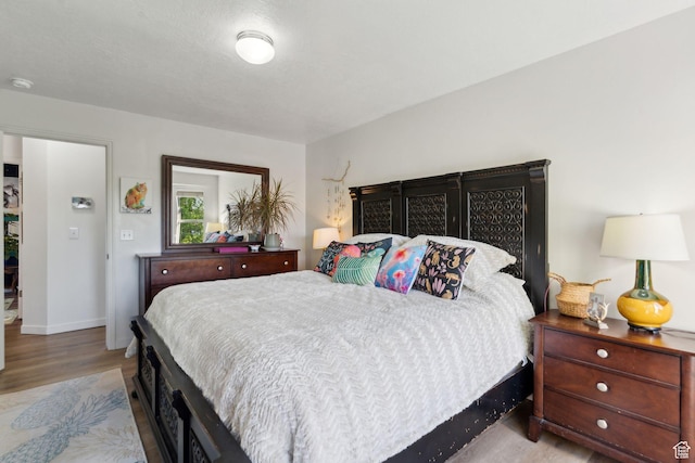 1298 E 5875 S, Ogden, UT 84405 - bedroom featuring wood finished floors and baseboards