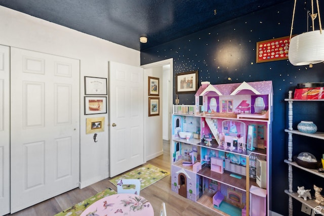 1298 E 5875 S, Ogden, UT 84405 - recreation room with wood finished floors and baseboards