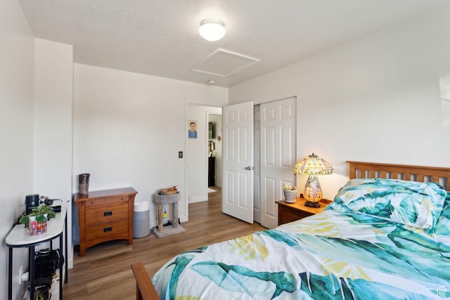 1298 E 5875 S, Ogden, UT 84405 - bedroom featuring attic access, wood finished floors, and a closet