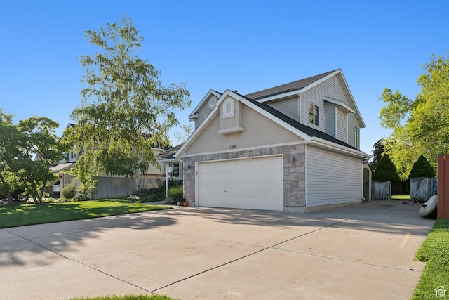 1298 E 5875 S, Ogden, UT 84405 - view of property exterior with driveway and stone siding