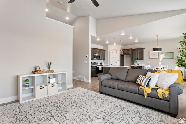 3287 S 4950 W, West Haven, UT 84401 - living area with ceiling fan, light wood-type flooring, baseboards, recessed lighting, and high vaulted ceiling