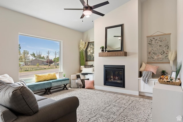 3287 S 4950 W, West Haven, UT 84401 - living area featuring a glass covered fireplace, ceiling fan, wood finished floors, and lofted ceiling