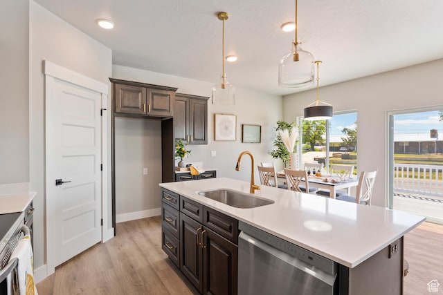 3287 S 4950 W, West Haven, UT 84401 - kitchen with stainless steel dishwasher, a sink, light countertops, light wood-type flooring, and recessed lighting