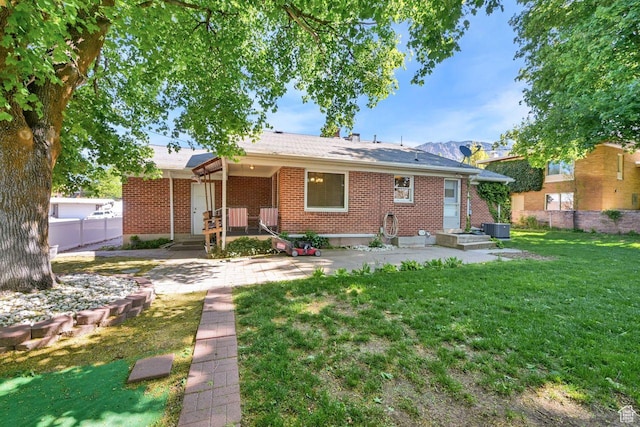 1375 E 3100th St S, Ogden, UT 84403 - back of house featuring brick siding and central AC unit