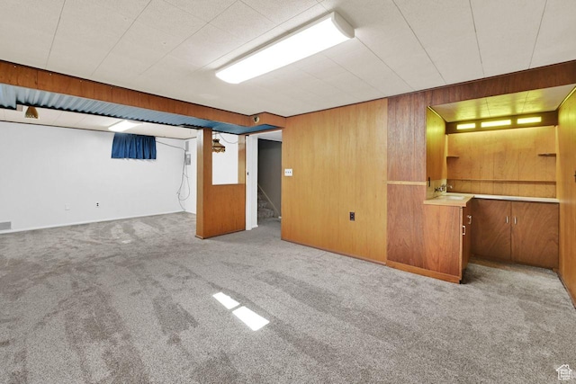 1375 E 3100th St S, Ogden, UT 84403 - finished basement featuring wooden walls, carpet flooring, stairs, and a sink