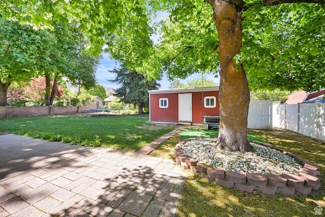 1375 E 3100th St S, Ogden, UT 84403 - view of yard with a trampoline, an outbuilding, and a patio area