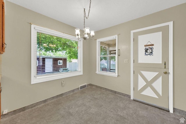 1375 E 3100th St S, Ogden, UT 84403 - unfurnished dining area with a chandelier and baseboards