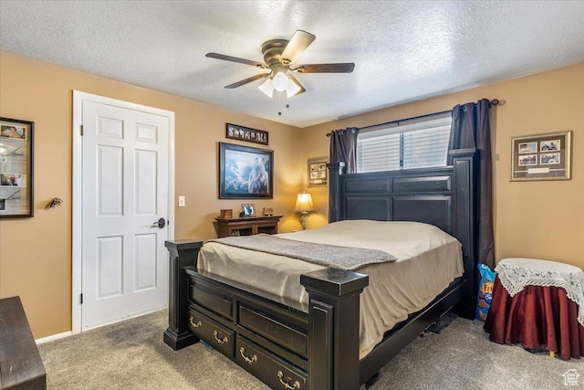 carpeted bedroom featuring a ceiling fan, a textured ceiling, and baseboards