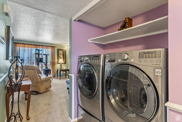 laundry area featuring separate washer and dryer, a textured ceiling, and carpet